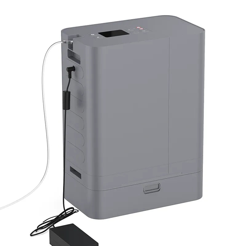 The Kingon P2 TOC Transportable Oxygen Concentrator plugged in with power and nasal cannula. 