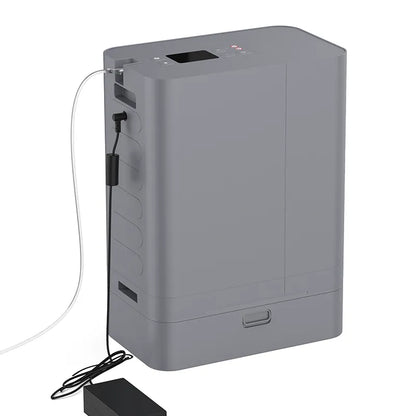 The Kingon P2 TOC Transportable Oxygen Concentrator plugged in with power and nasal cannula. 
