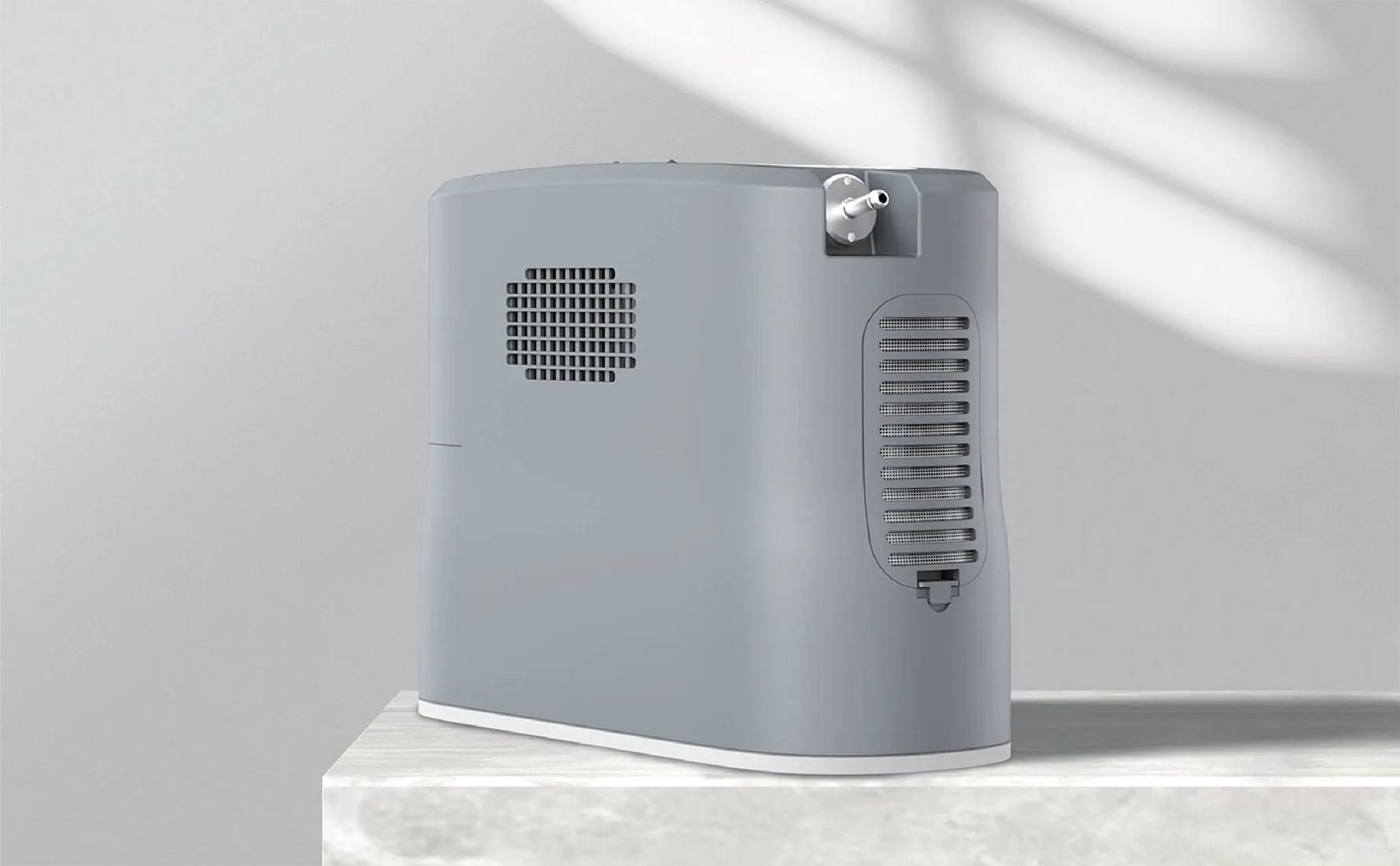 Kingon P2-E portable oxygen concentrator on a marble bench.